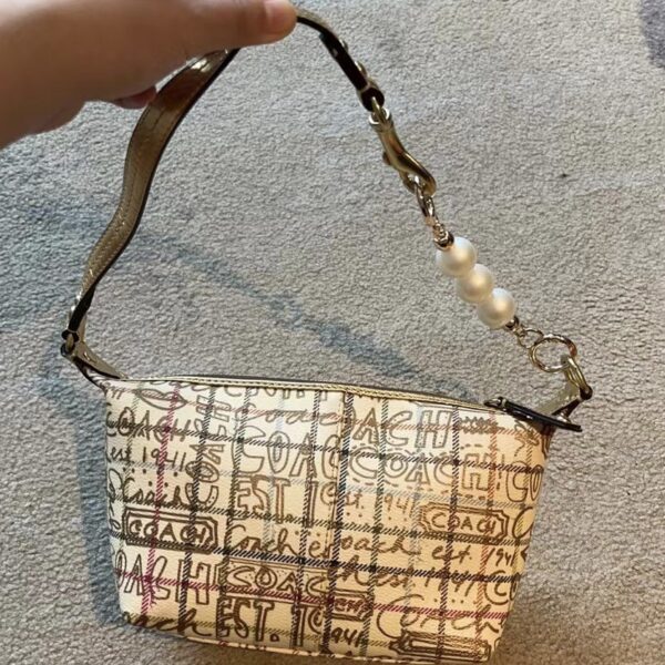 Coach 小金色手提包